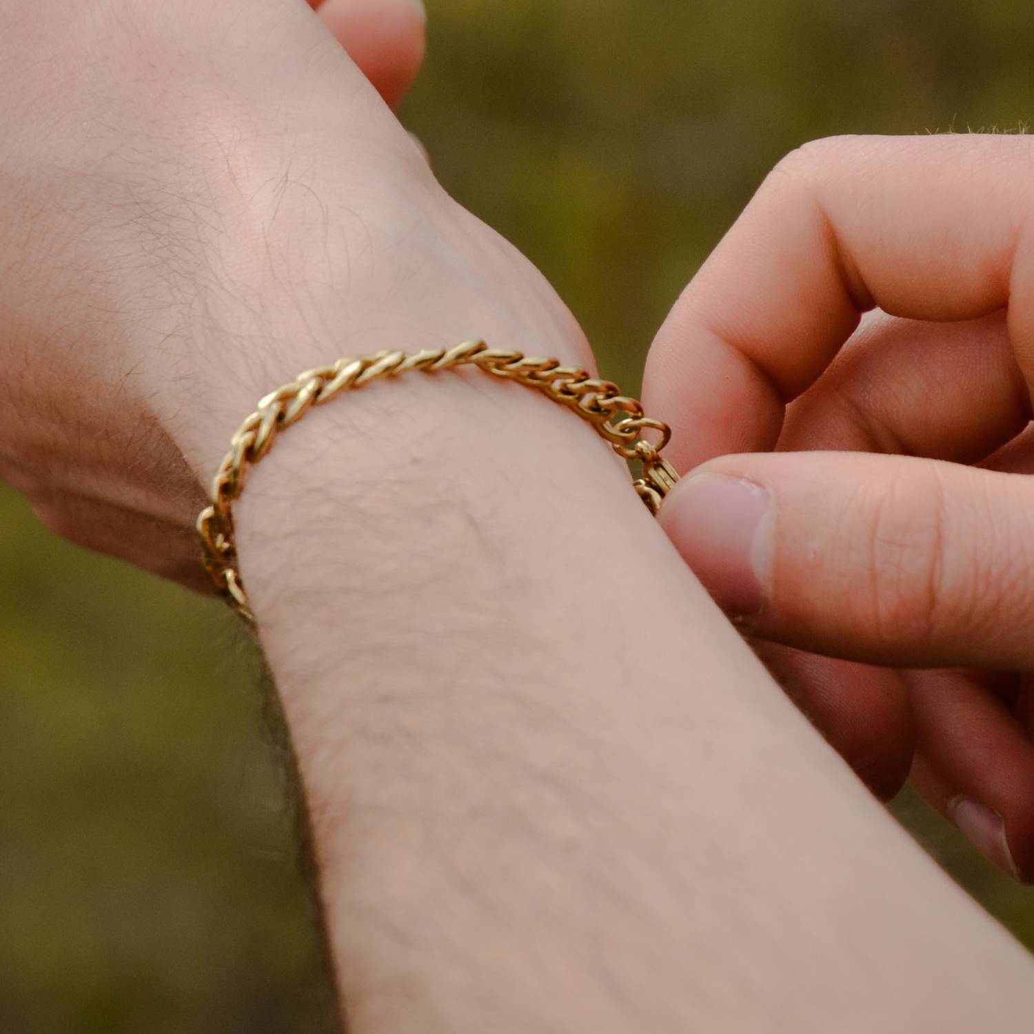 A chain bracelet on a man's wrist